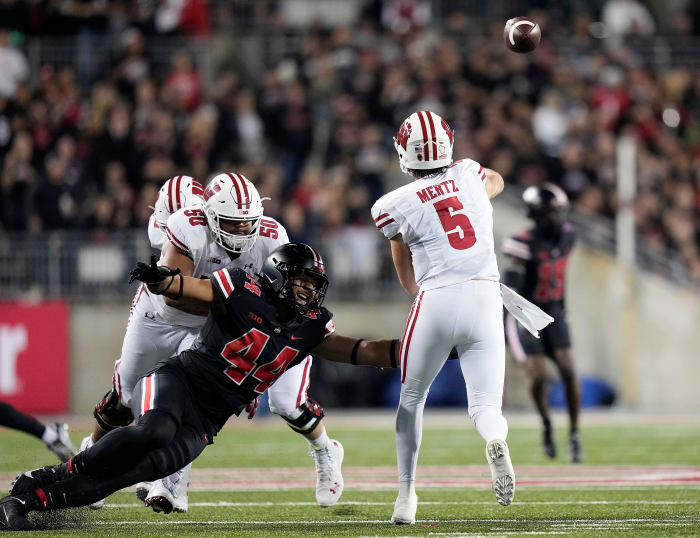 Wisconsin quarterback Graham Mertz throwing the football against Ohio State.